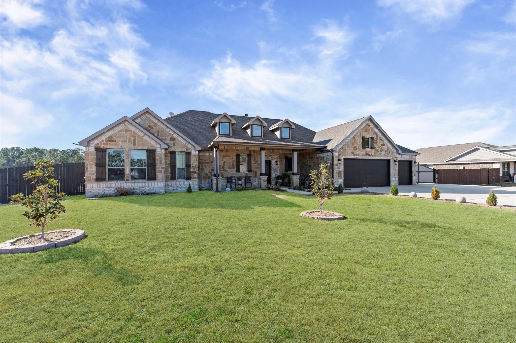 9729 Hidalgo Street Conroe, TX 77303 - Photo 3 of 38 This beautiful home features a spacious recently tiled front porch, and a large over 1 acre yard. It includes a three-car garage and is located in a quiet neighborhood, perfect for families.
