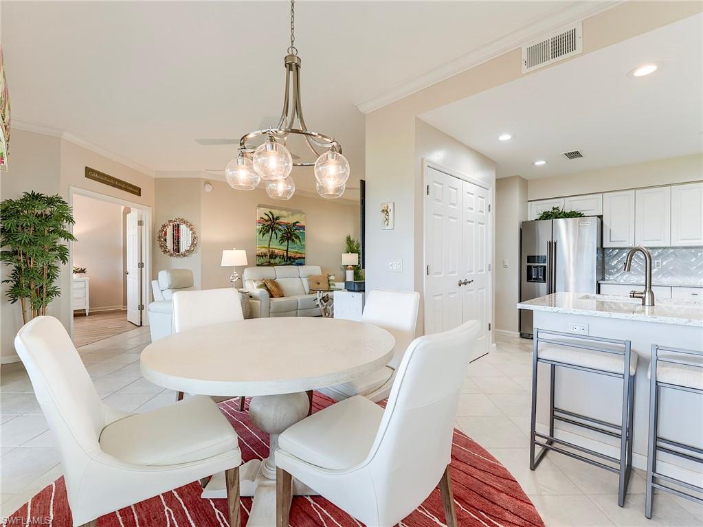 23011 Rosedale Drive, Unit 101 Estero, FL 34135 - Photo 11 of 34 a view of a dining room with furniture