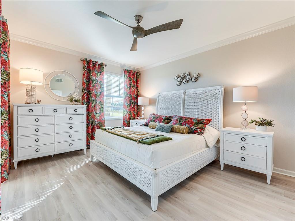 23011 Rosedale Drive, Unit 101 Estero, FL 34135 - Photo 20 of 34 a bed room with a bed and a dresser