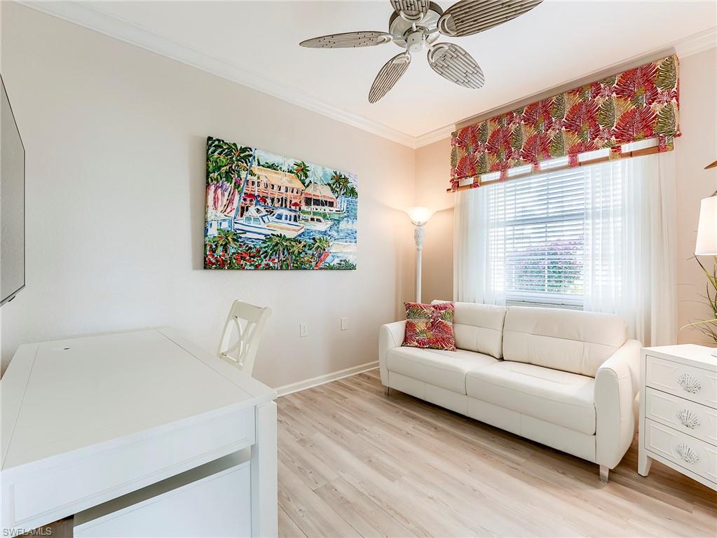 23011 Rosedale Drive, Unit 101 Estero, FL 34135 - Photo 25 of 34 a living room with furniture and a window