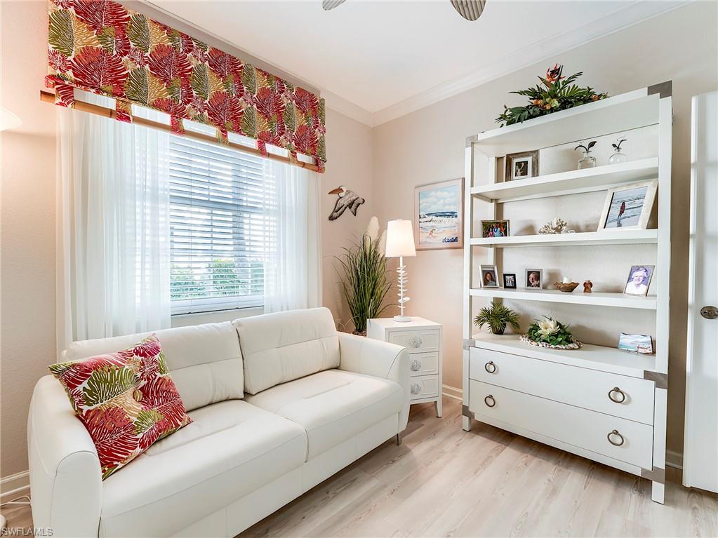 23011 Rosedale Drive, Unit 101 Estero, FL 34135 - Photo 27 of 34 a living room with furniture and a window