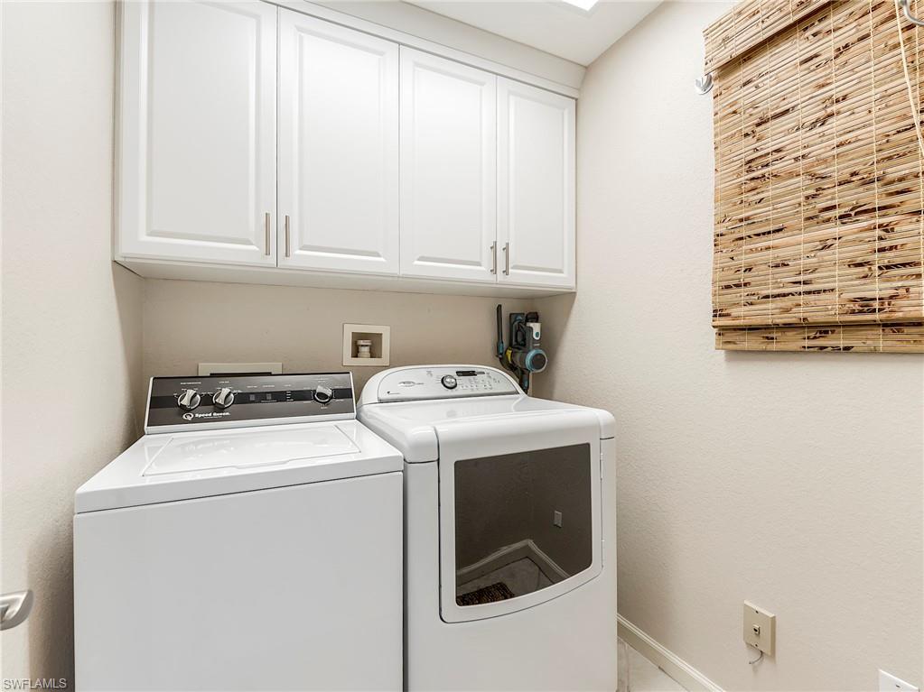 23011 Rosedale Drive, Unit 101 Estero, FL 34135 - Photo 31 of 34 a utility room with dryer and washer