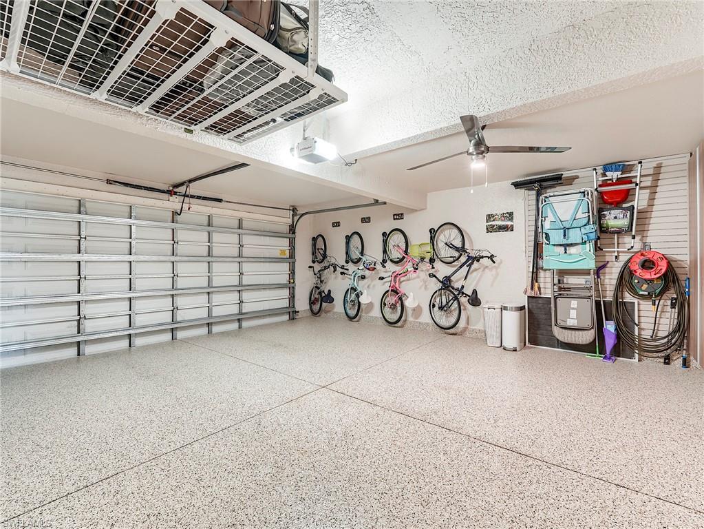23011 Rosedale Drive, Unit 101 Estero, FL 34135 - Photo 32 of 34 a view of a garage with storage
