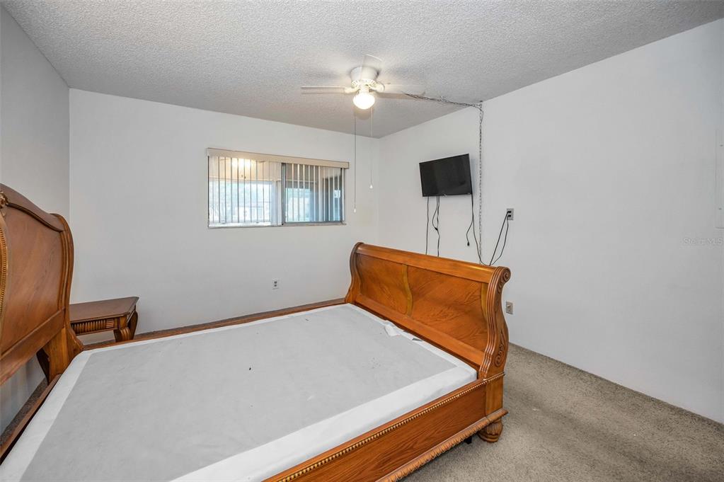 3116 Highlands Boulevard, Unit 3116 Palm Harbor, FL 34684 - Photo 23 of 56 a room with windows and ceiling fan