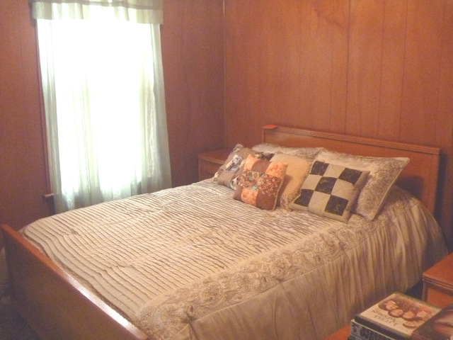208 Elm Street Cedar Point, IL 61316 - Photo 4 of 10 a bedroom with a bed and a window