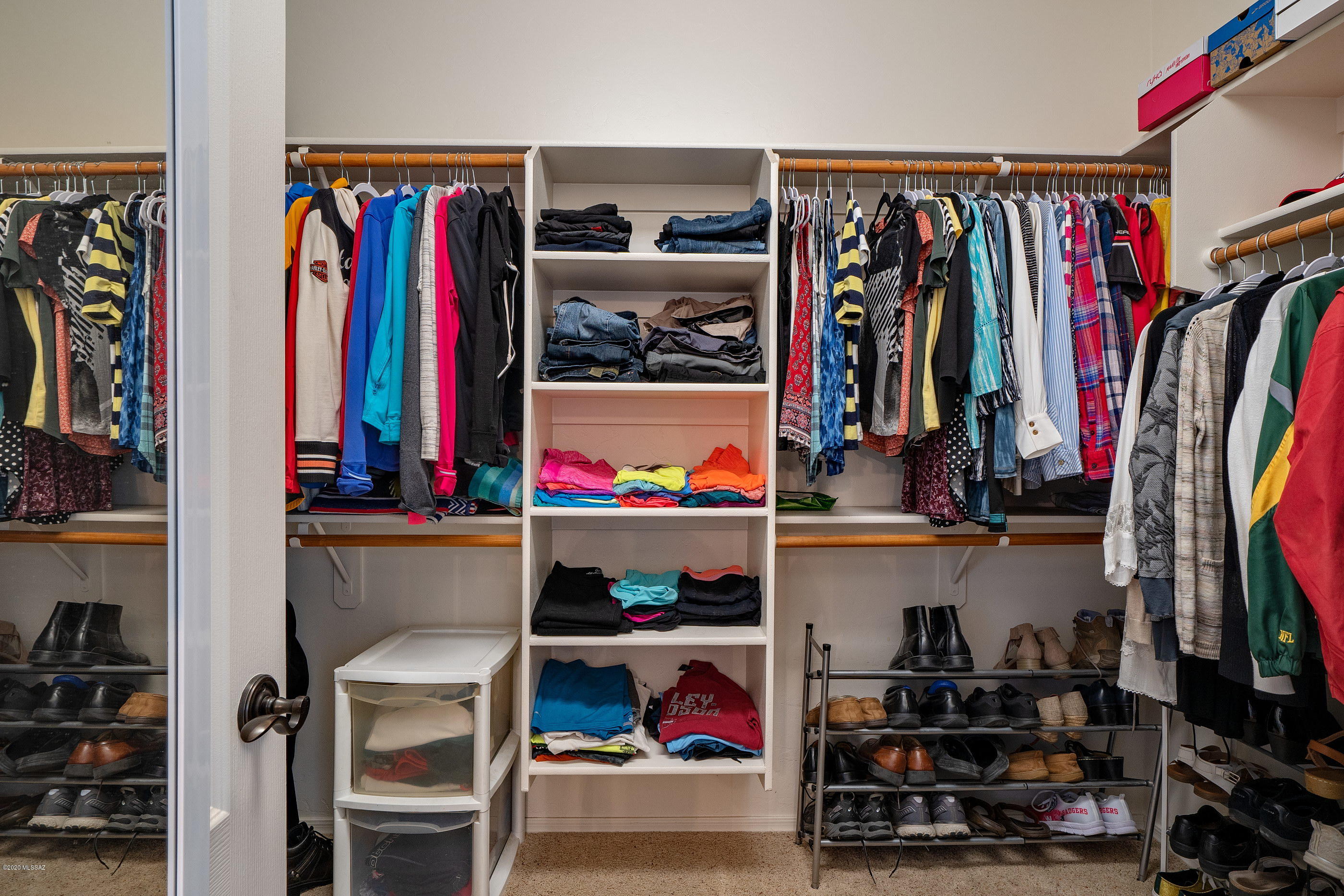 4440 West Crystal Ranch Place Marana, AZ 85658 - Photo 26 of 28 a view of walk in closet with clothes and shoes