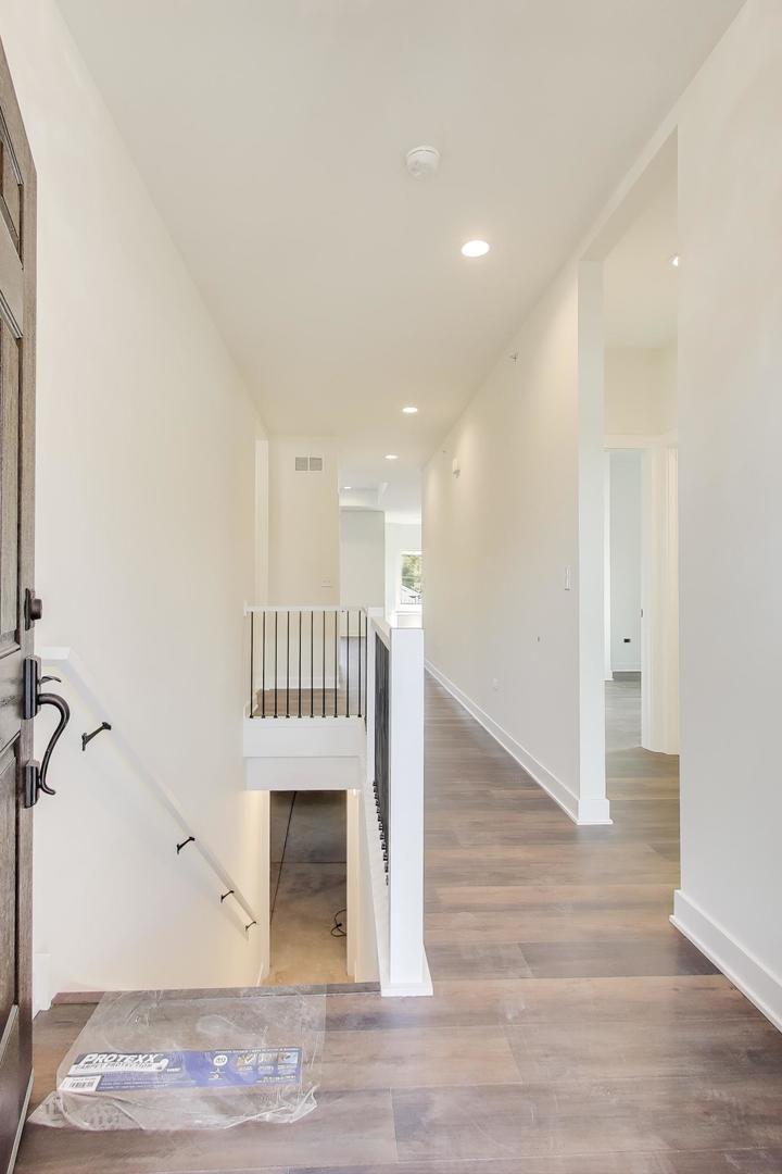 898 North Quentin Road Palatine, IL 60067 - Photo 4 of 28 a view of entryway with wooden floor