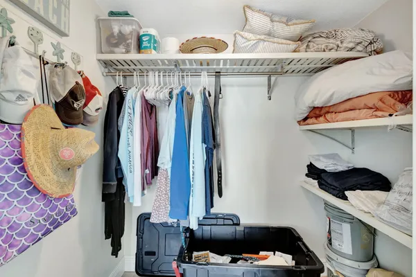 a bathroom with a sink a light fixture a vanity and a mirror