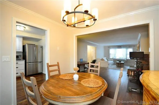 a view of a dining room with furniture and wooden floor