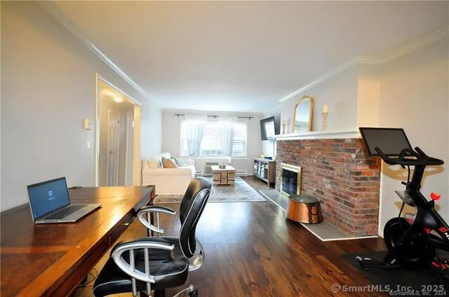 a living room with furniture and a fireplace