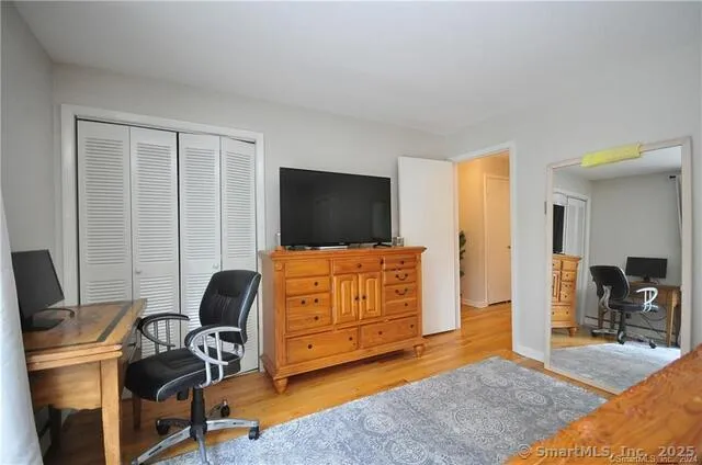 a view of a livingroom with workspace and a couch
