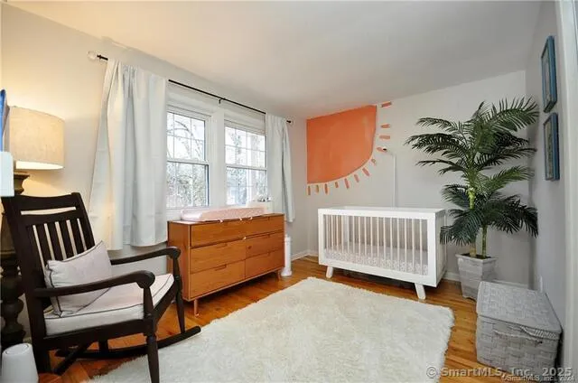 a bedroom with furniture and a window