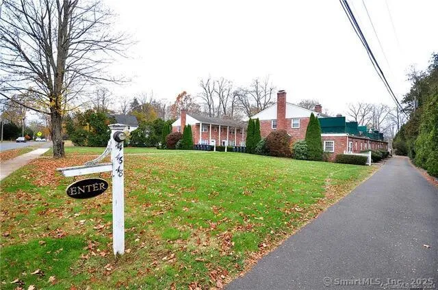 a view of a garden with a building