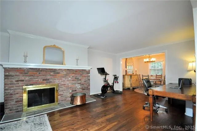 a living room with furniture fireplace and a table
