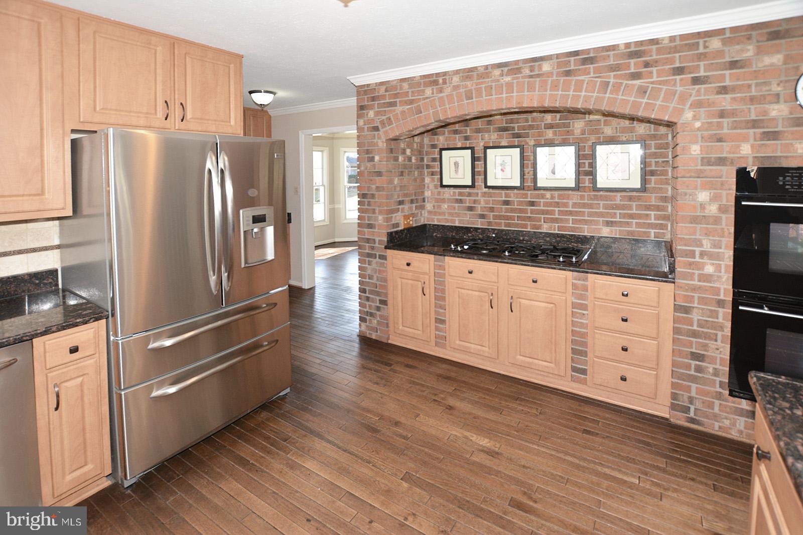 81 Rutherford Circle Sterling, VA 20165 - Photo 17 of 55 Exposed brick in the kitchen