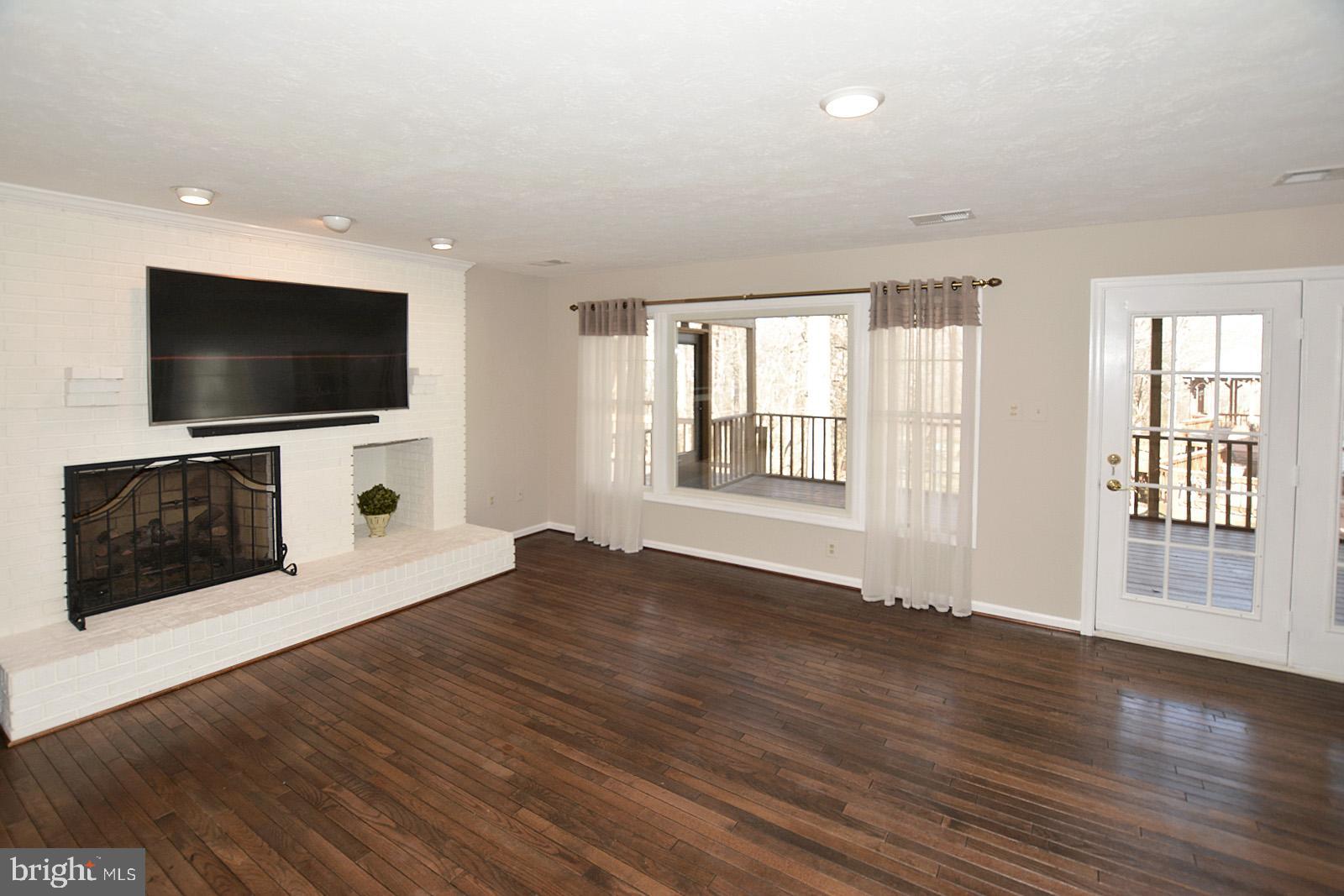 81 Rutherford Circle Sterling, VA 20165 - Photo 26 of 55 Family room looks out onto screened porch
