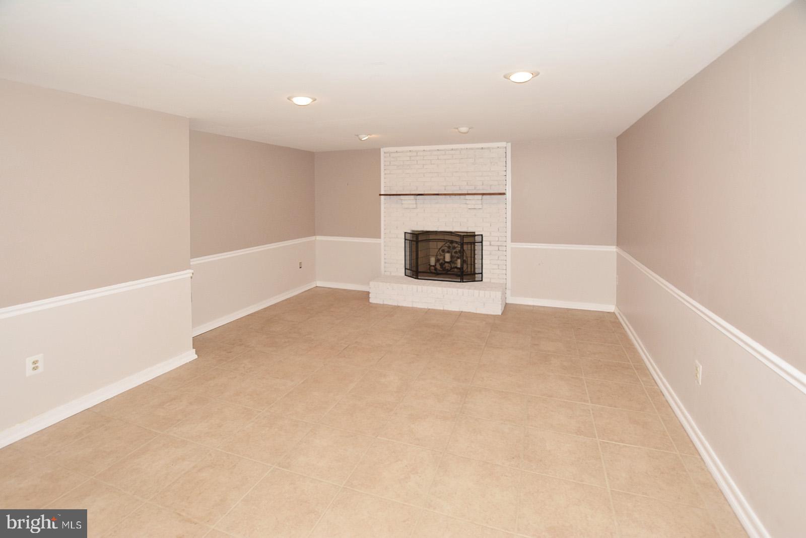 81 Rutherford Circle Sterling, VA 20165 - Photo 44 of 55 Fireplace in lower level