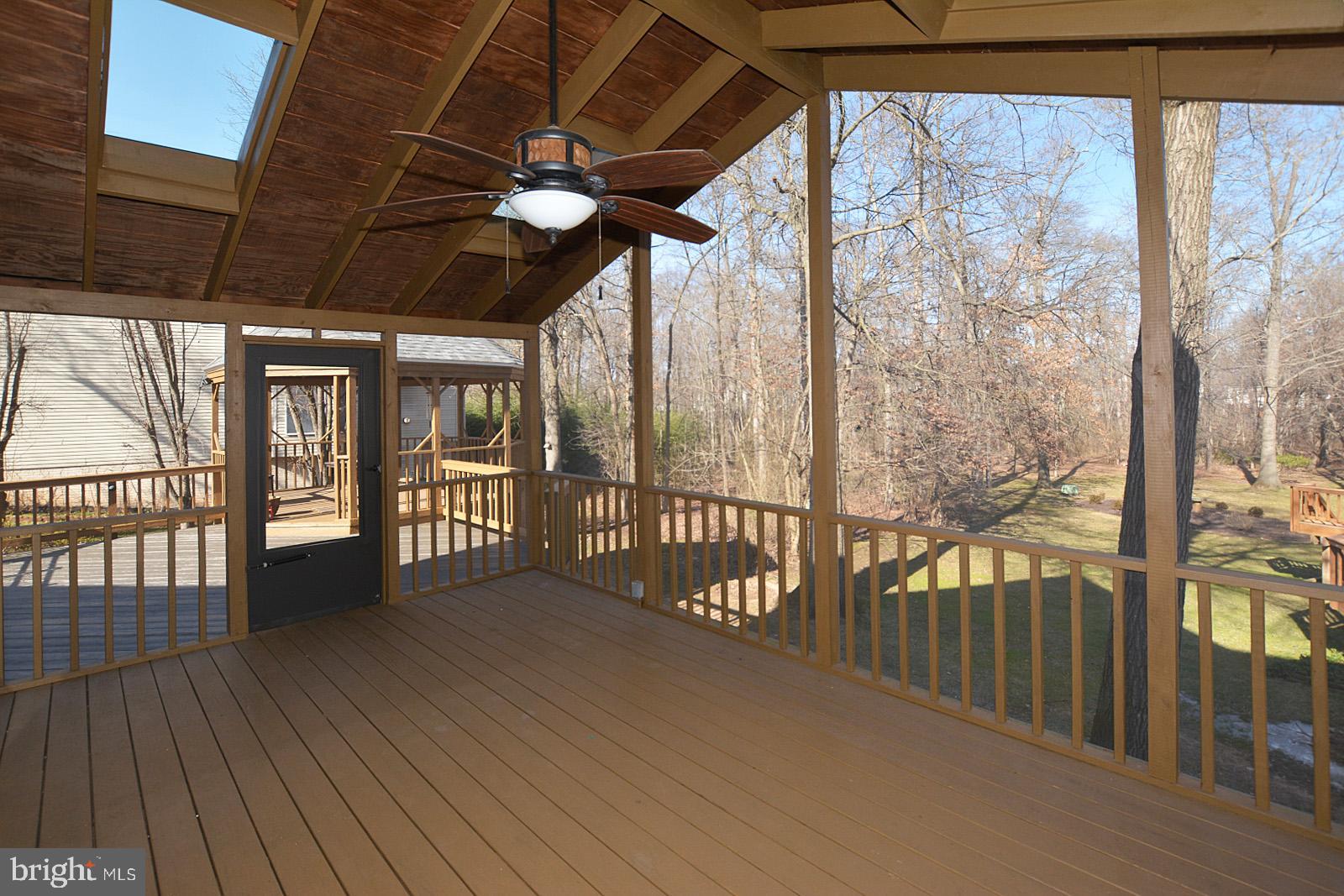 81 Rutherford Circle Sterling, VA 20165 - Photo 48 of 55 Large screened porch overlooks serene lot