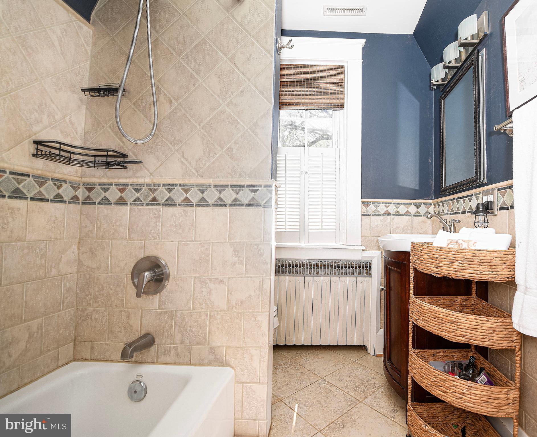 722 Anneslie Road Baltimore, MD 21212 - Photo 24 of 46 a bathroom with a tub sink and mirror