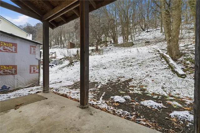 a view of a backyard of the house