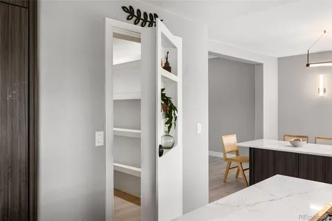 a large kitchen with kitchen island a sink a counter space and stainless steel appliances