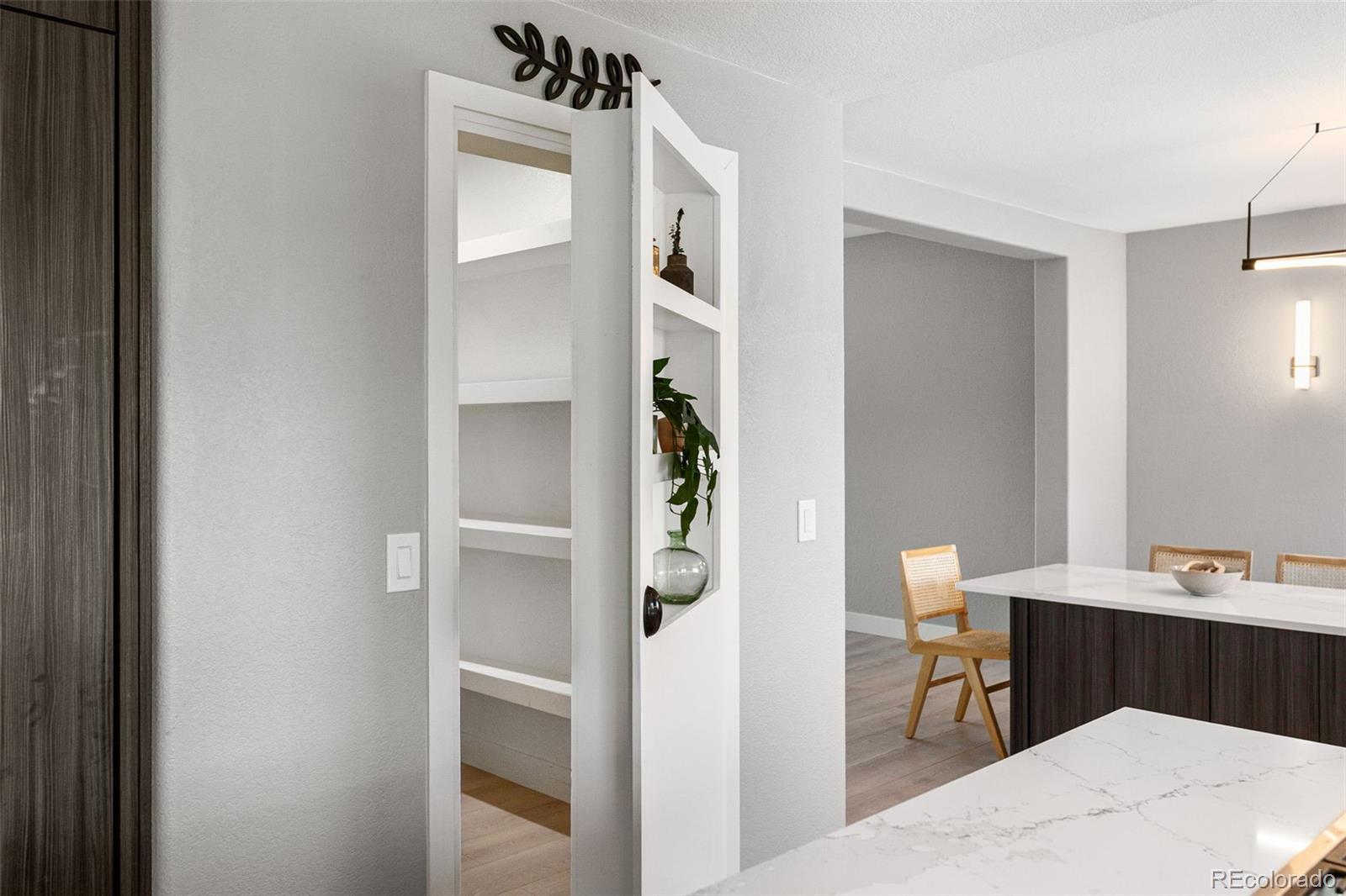 7400 South Genoa Circle Centennial, CO 80016 - Photo 13 of 50 a room with a bed and a table in it