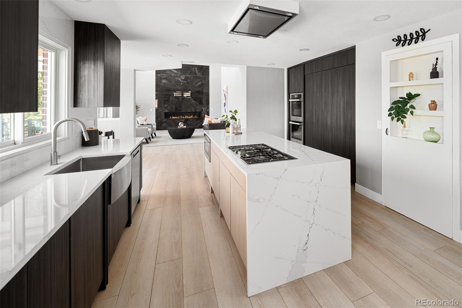 7400 South Genoa Circle Centennial, CO 80016 - Photo 14 of 50 a kitchen with granite countertop a sink stove and refrigerator