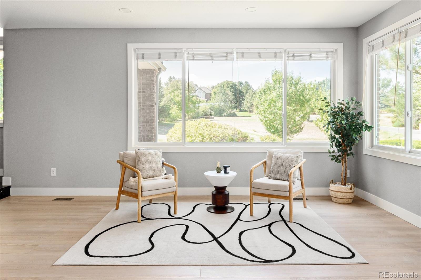 7400 South Genoa Circle Centennial, CO 80016 - Photo 19 of 50 a living room with furniture and a large window