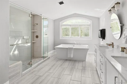 a kitchen with stainless steel appliances a sink stove and cabinets