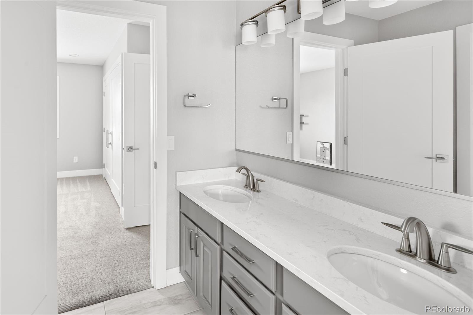 7400 South Genoa Circle Centennial, CO 80016 - Photo 29 of 50 a bathroom with a sink and a mirror