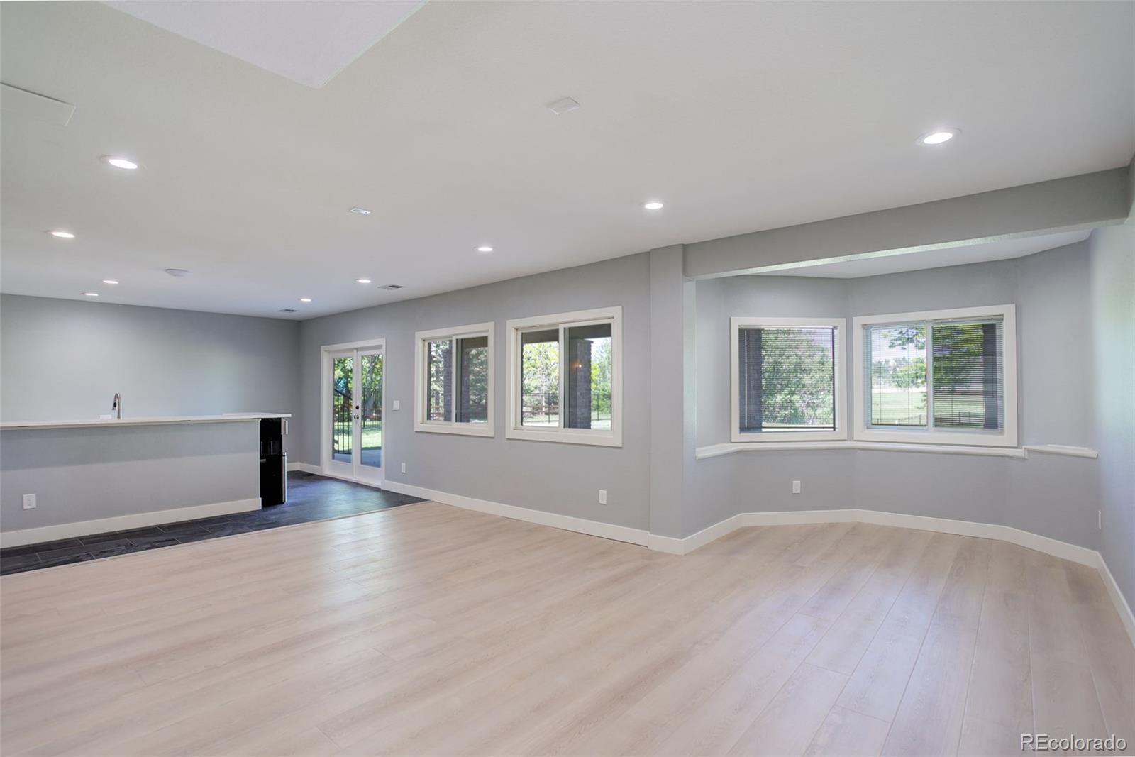 7400 South Genoa Circle Centennial, CO 80016 - Photo 43 of 50 an empty room with wooden floor and windows
