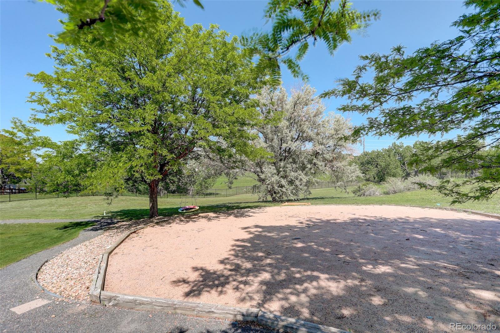 7400 South Genoa Circle Centennial, CO 80016 - Photo 44 of 50 a view of a yard with a tree