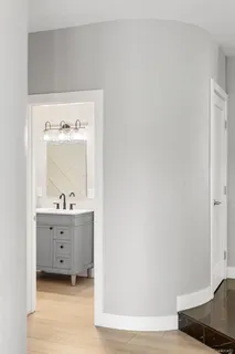 a living room with furniture and large windows