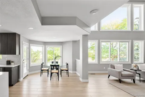 a kitchen with stainless steel appliances a sink cabinets and wooden floor