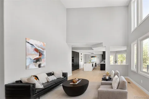 a kitchen with granite countertop a sink stove and refrigerator