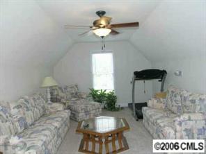 708 Flamingo Road Clover, SC 29710 - Photo 6 of 8 a living room with furniture and a chandelier