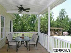 708 Flamingo Road Clover, SC 29710 - Photo 7 of 8 a view of a dining table and chairs in the balcony