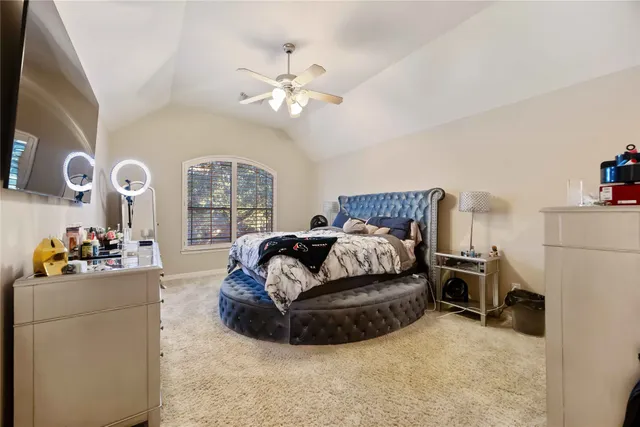 a bedroom with a bed furniture and window