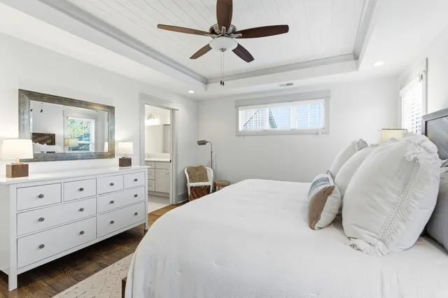 a bedroom with bed and window