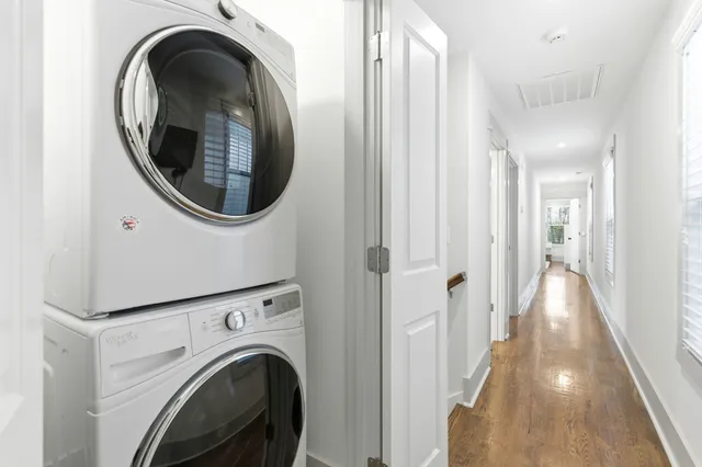 a view of a hallway with washer and dryer