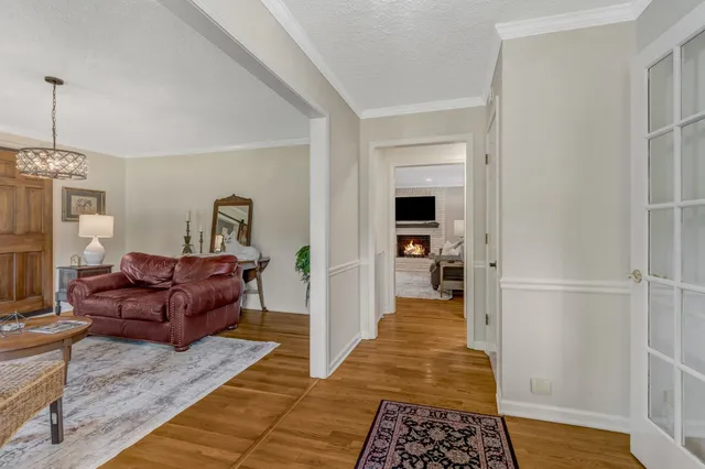 a living room with furniture and a rug