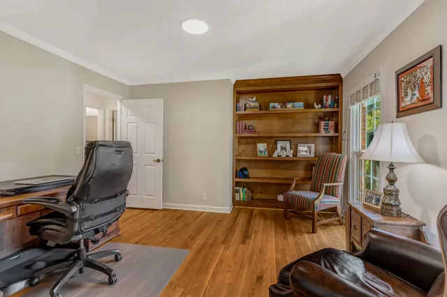a workspace with furniture and wooden floor