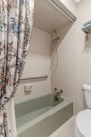 a bathroom with a sink a toilet and a bathtub