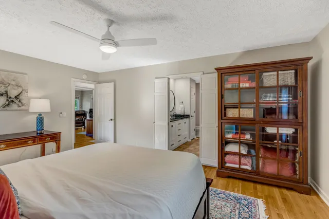 a bedroom with a bed and a large cabinets