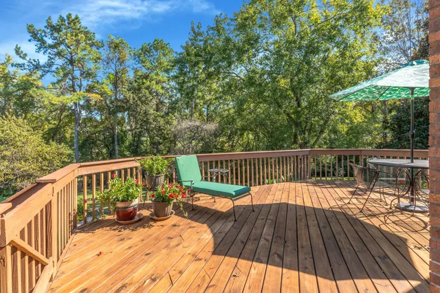 a view of balcony with deck and wooden floor