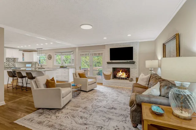 a living room with furniture and a fireplace or television