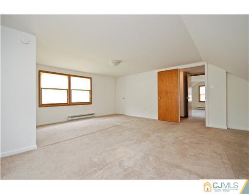 93 Idlewild Road Edison, NJ 08817 - Photo 14 of 18 a view of an empty room with a window