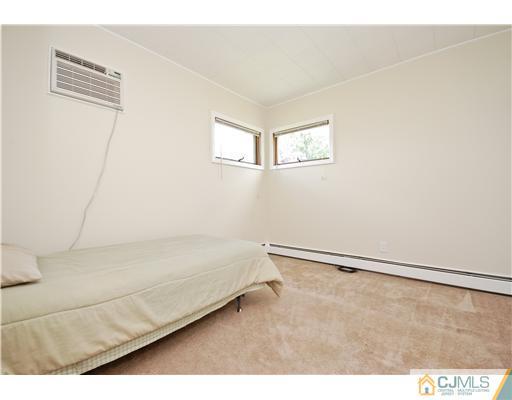 93 Idlewild Road Edison, NJ 08817 - Photo 8 of 18 a bathroom with a bathtub and a shower