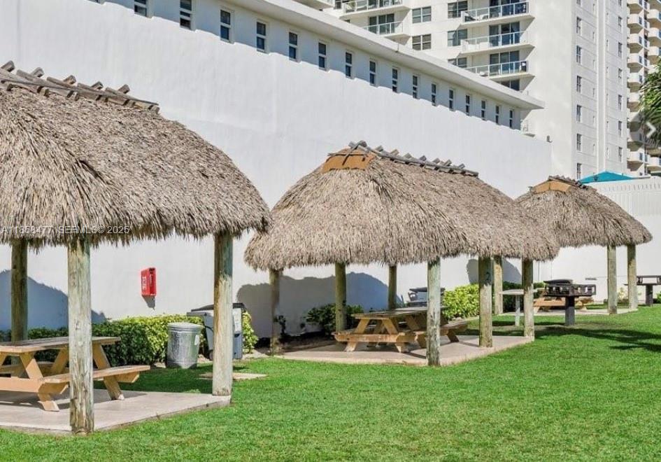 5601 Collins Avenue, Unit 820 Miami Beach, FL 33140 - Photo 18 of 23 a view of a house with backyard porch and sitting area