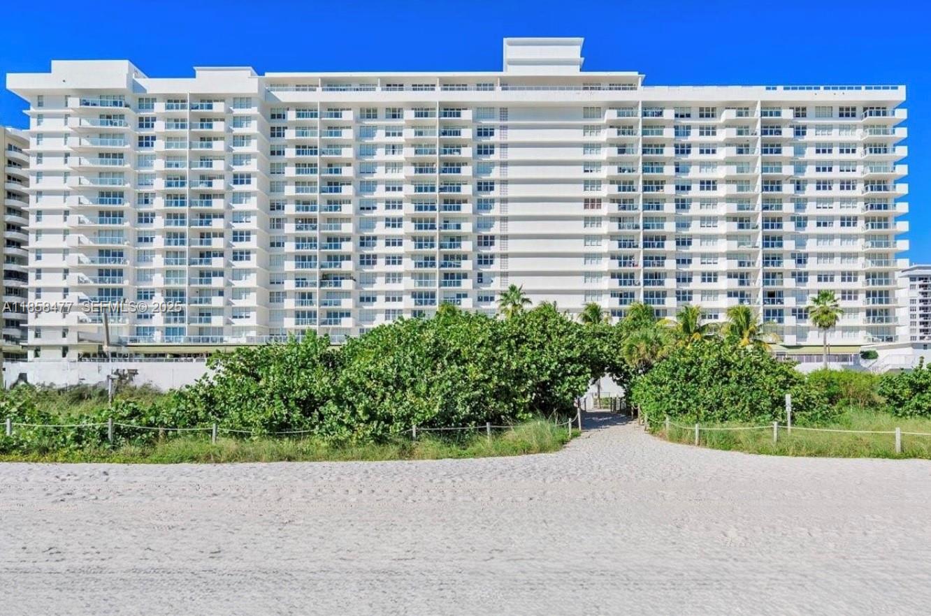 5601 Collins Avenue, Unit 820 Miami Beach, FL 33140 - Photo 22 of 23 a street view with tall buildings